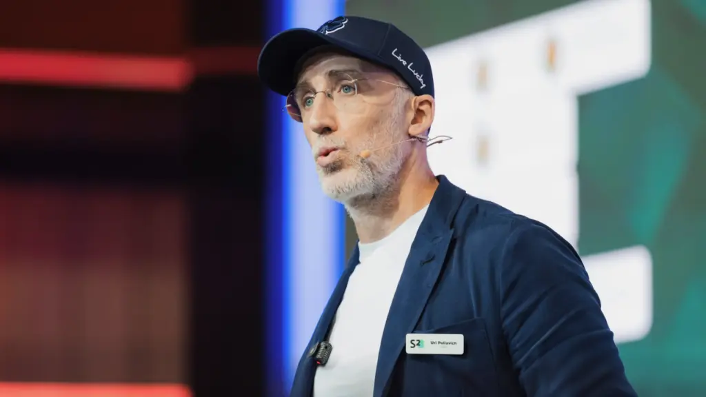 Uri Poliavich addressing an audience at a Soft2Bet corporate event